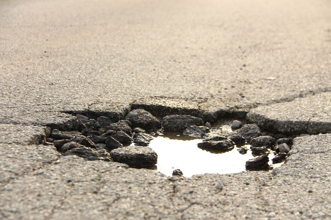 How To Fix Potholes and Cracks in Your Parking Lot